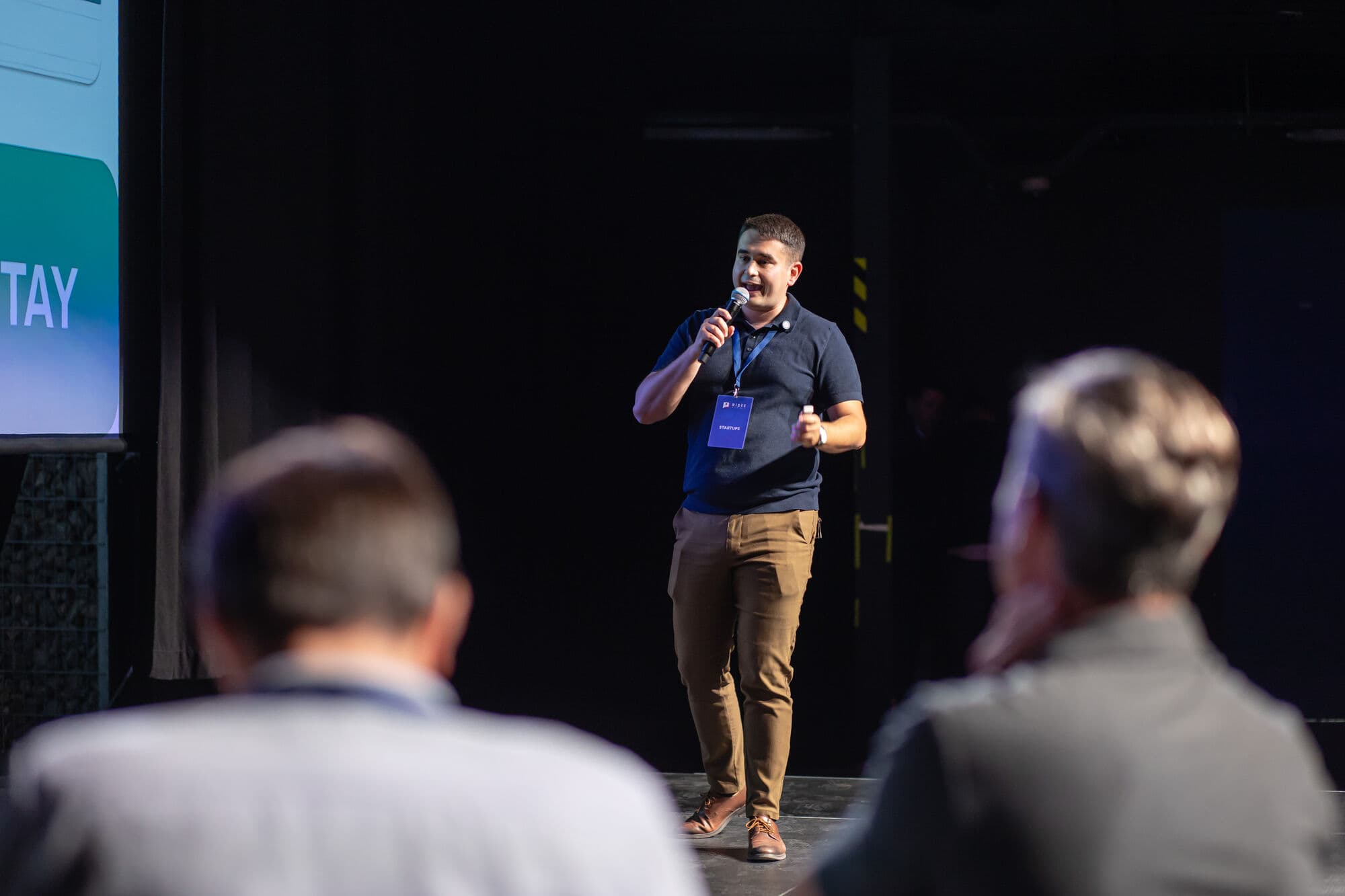 A Batch 2 founder pitching on stage at RiSEE Summit 2026